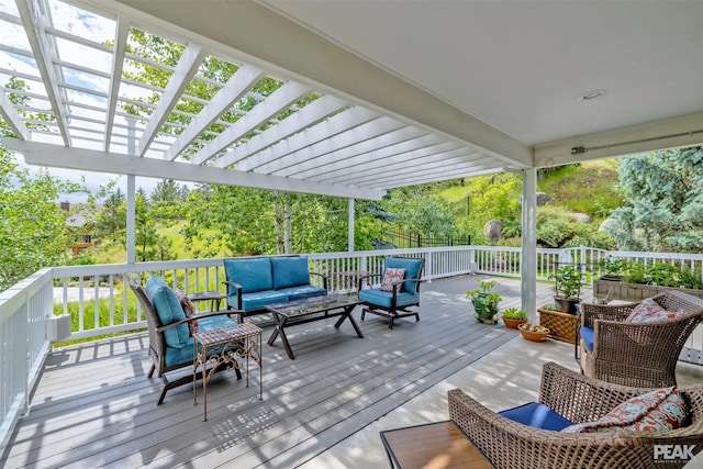 deck with a pergola and an outdoor hangout area