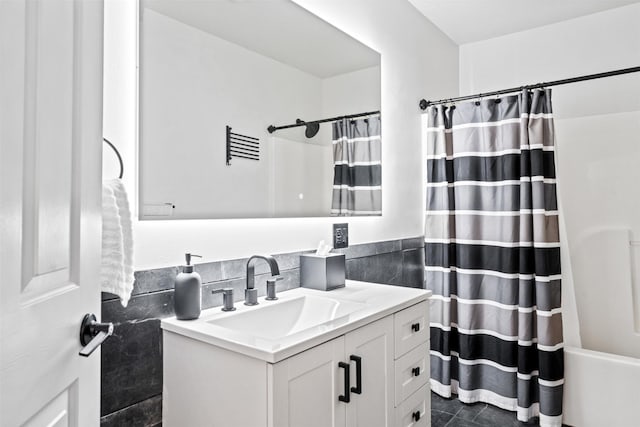 bathroom with vanity and shower / tub combo with curtain