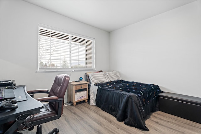 bedroom featuring wood finished floors