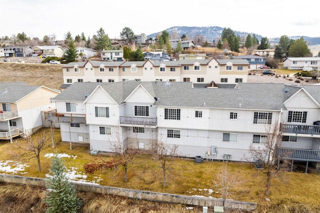 birds eye view of property with a residential view and a mountain view