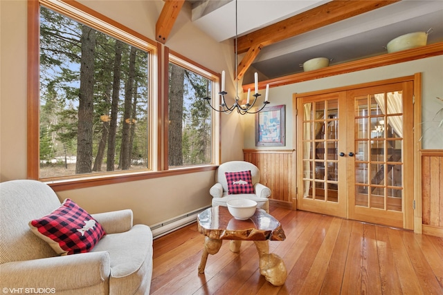 sitting room featuring beam ceiling, french doors, wood-type flooring, and a baseboard radiator