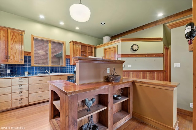 kitchen with tile countertops, open shelves, light wood-style flooring, recessed lighting, and decorative backsplash