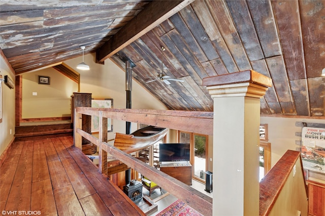 hall featuring lofted ceiling with beams, wood ceiling, and hardwood / wood-style flooring