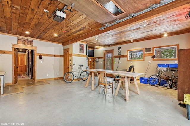 dining space with wooden ceiling, baseboards, and concrete flooring