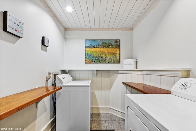 laundry area with laundry area, granite finish floor, crown molding, and independent washer and dryer