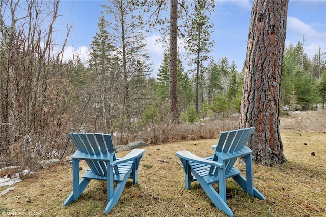 view of property's community featuring a wooded view