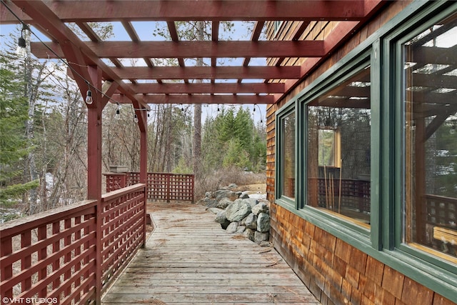 wooden terrace with a pergola