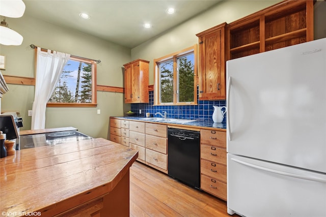 kitchen featuring electric range oven, freestanding refrigerator, tile countertops, light wood-style floors, and dishwasher