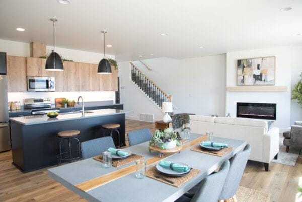 dining room with visible vents, stairway, recessed lighting, light wood-style floors, and a glass covered fireplace