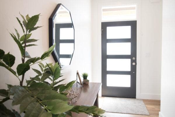 foyer entrance featuring baseboards and wood finished floors