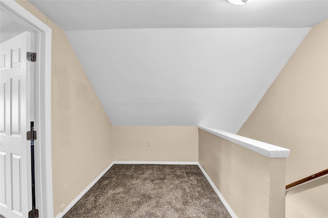 bonus room featuring vaulted ceiling, baseboards, and carpet floors