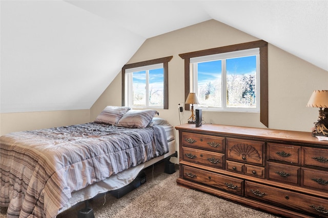 bedroom with lofted ceiling and carpet