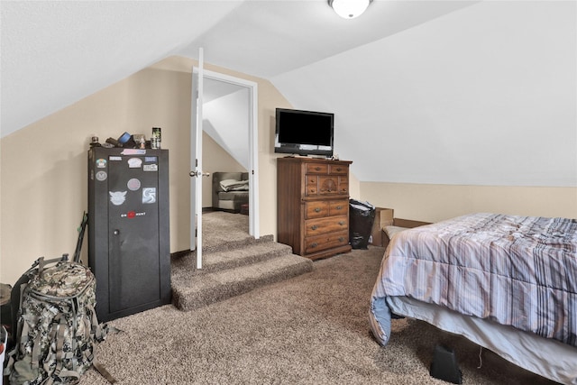 carpeted bedroom with vaulted ceiling