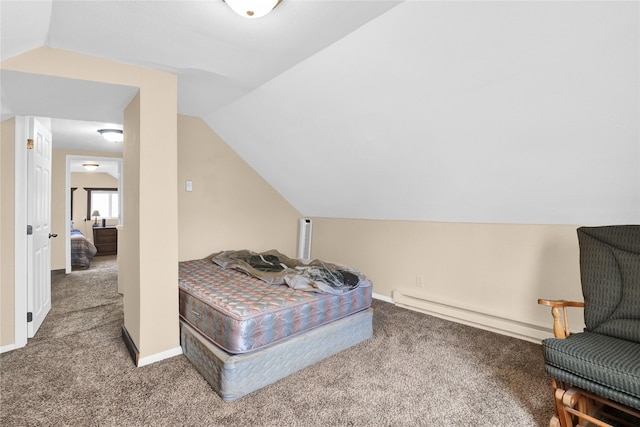 bedroom featuring baseboard heating, lofted ceiling, and carpet floors