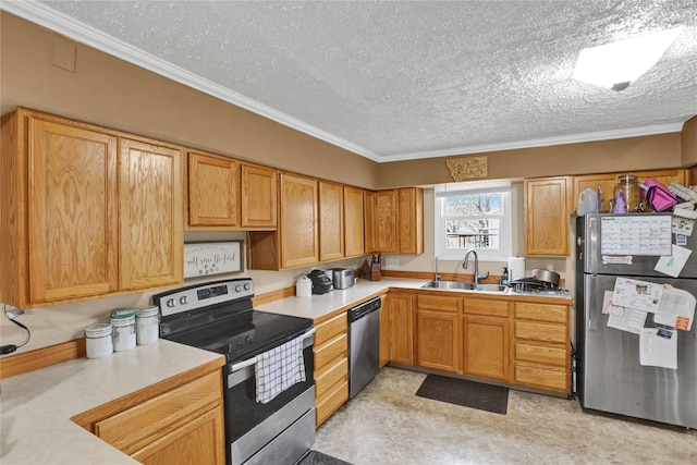 kitchen with ornamental molding, a sink, a textured ceiling, appliances with stainless steel finishes, and light countertops