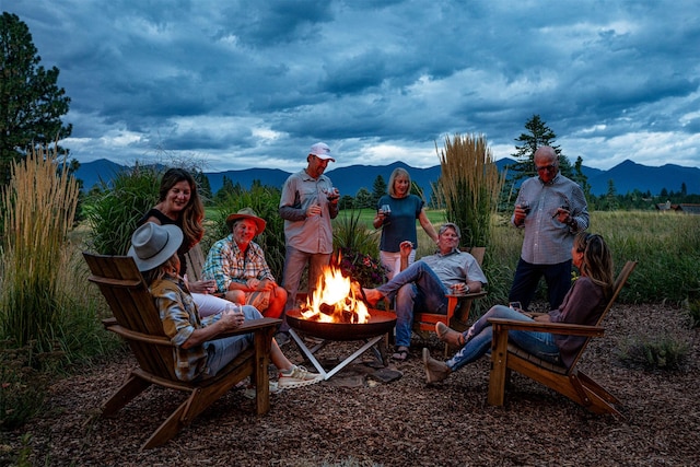 1615 Wilderness Club Dr, Eureka, MT 59917 - exterior space with a mountain view and an outdoor fire pit