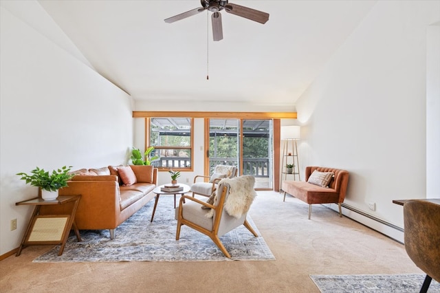 living area with a baseboard heating unit, baseboards, ceiling fan, vaulted ceiling, and carpet floors