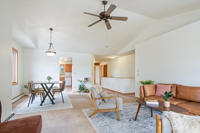 living room featuring a wealth of natural light, a baseboard radiator, and a ceiling fan