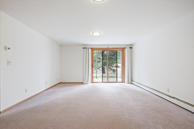 unfurnished room with baseboards, baseboard heating, and carpet