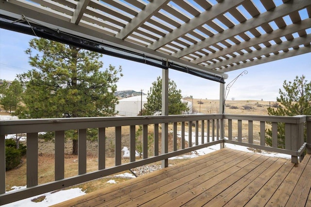 wooden deck featuring a mountain view and a pergola