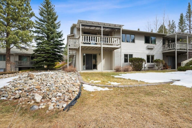 rear view of property with stairs