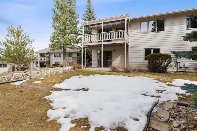 rear view of house featuring a balcony