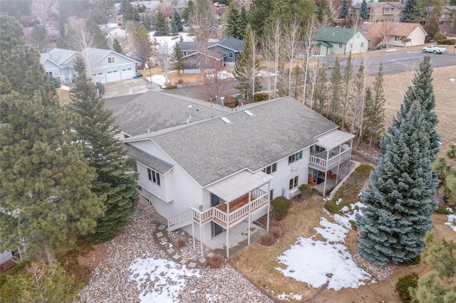 birds eye view of property with a residential view