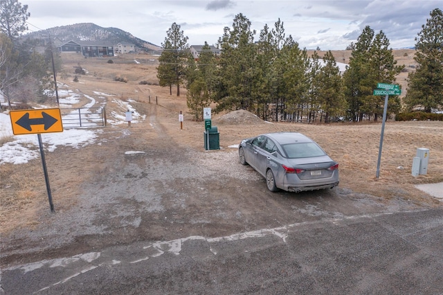 exterior space featuring a rural view and a mountain view