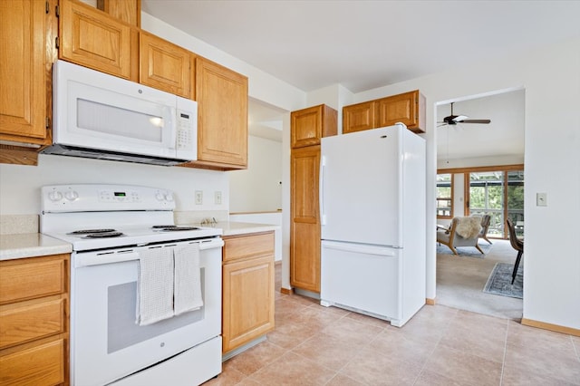 kitchen featuring white appliances, ceiling fan, light tile patterned flooring, and light countertops