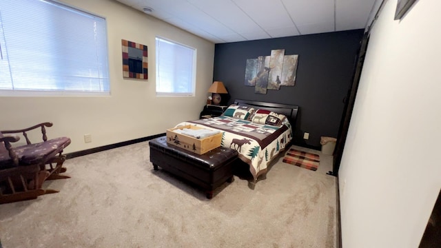 carpeted bedroom featuring baseboards