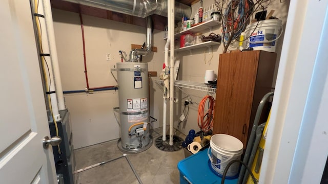 utility room featuring strapped water heater