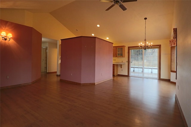 unfurnished living room with wood finished floors, baseboards, high vaulted ceiling, recessed lighting, and ceiling fan with notable chandelier