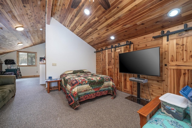 carpeted bedroom featuring a barn door, wood ceiling, and vaulted ceiling