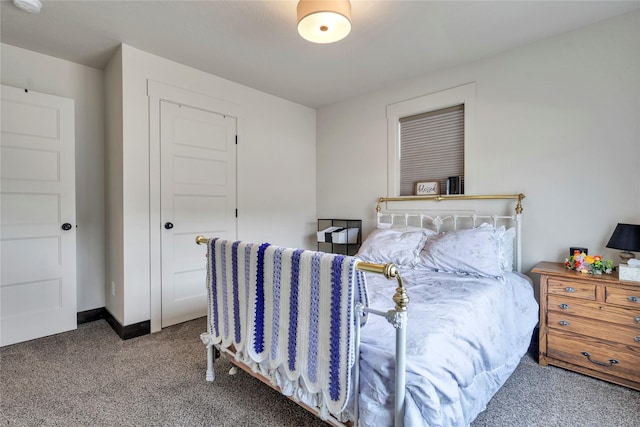 carpeted bedroom with baseboards