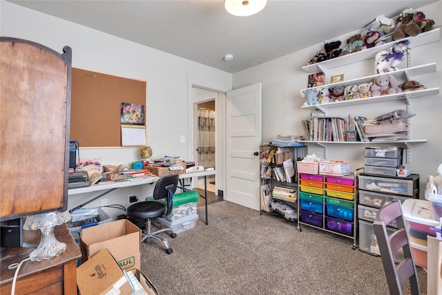 home office featuring a textured ceiling and carpet floors