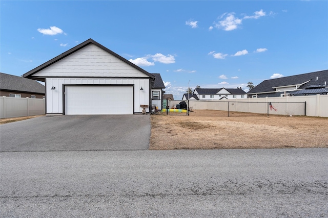 exterior space featuring fence and a garage