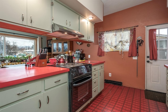 kitchen with light countertops, tile patterned floors, black range with electric stovetop, and under cabinet range hood