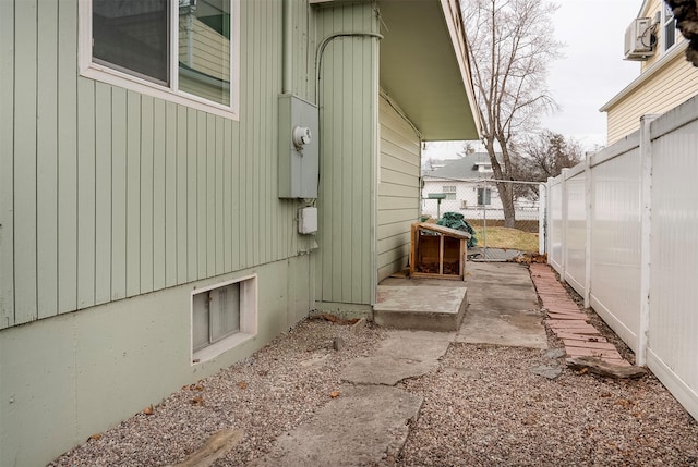 view of home's exterior with fence