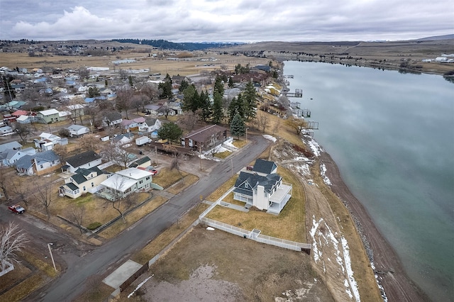 bird's eye view with a water view and a residential view