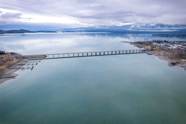 aerial view featuring a water and mountain view