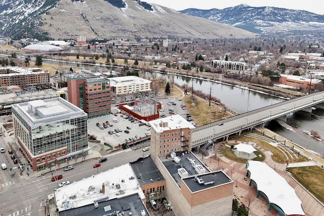 drone / aerial view featuring a water and mountain view