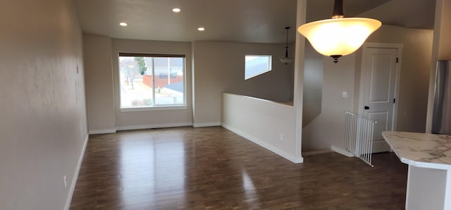 interior space with recessed lighting, dark wood-type flooring, and baseboards