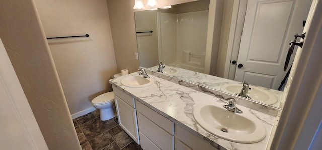 bathroom with double vanity and a sink