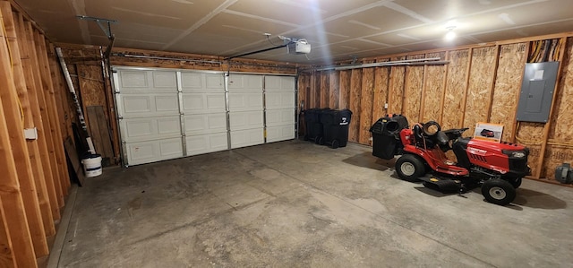 garage with electric panel and a garage door opener