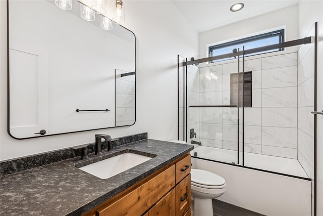 full bath with recessed lighting, toilet, vanity, and bath / shower combo with glass door