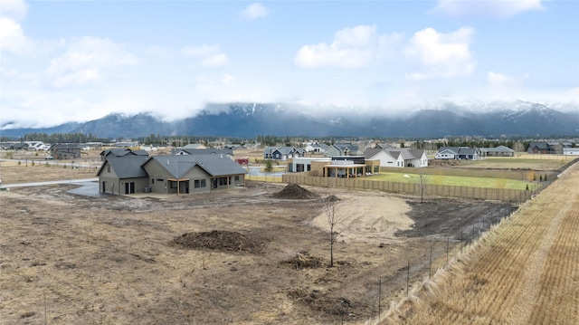 drone / aerial view featuring a mountain view and a residential view