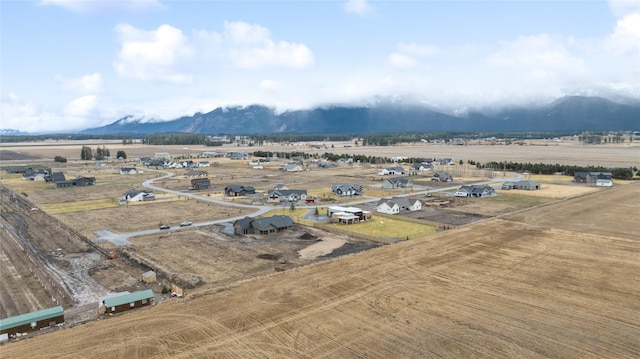 bird's eye view featuring a rural view and a mountain view