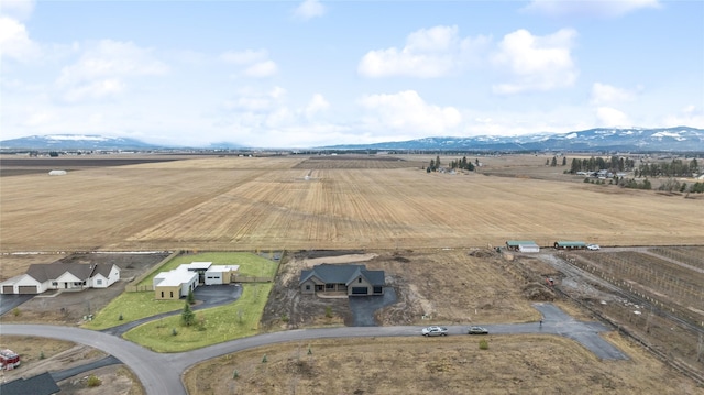 drone / aerial view with a mountain view and a rural view