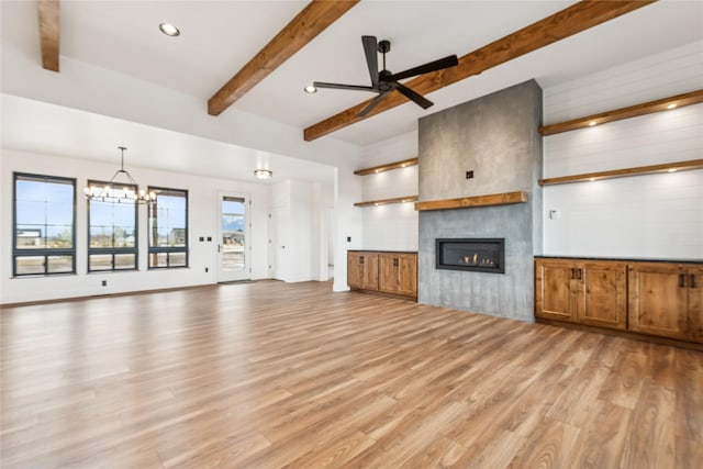 unfurnished living room with beamed ceiling, recessed lighting, ceiling fan with notable chandelier, a fireplace, and light wood-style floors