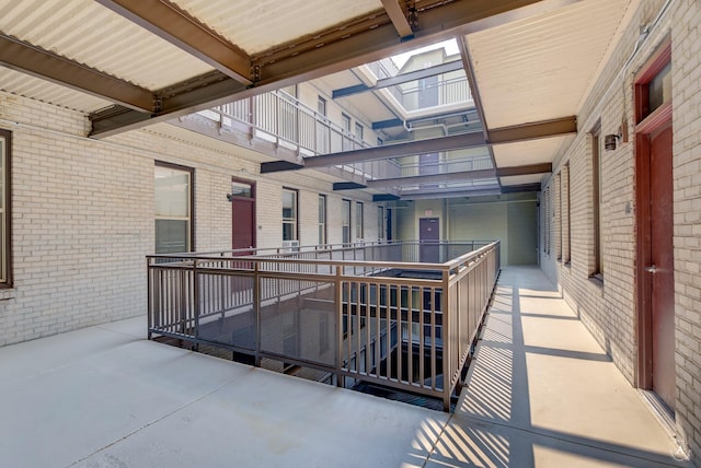 view of patio featuring a balcony